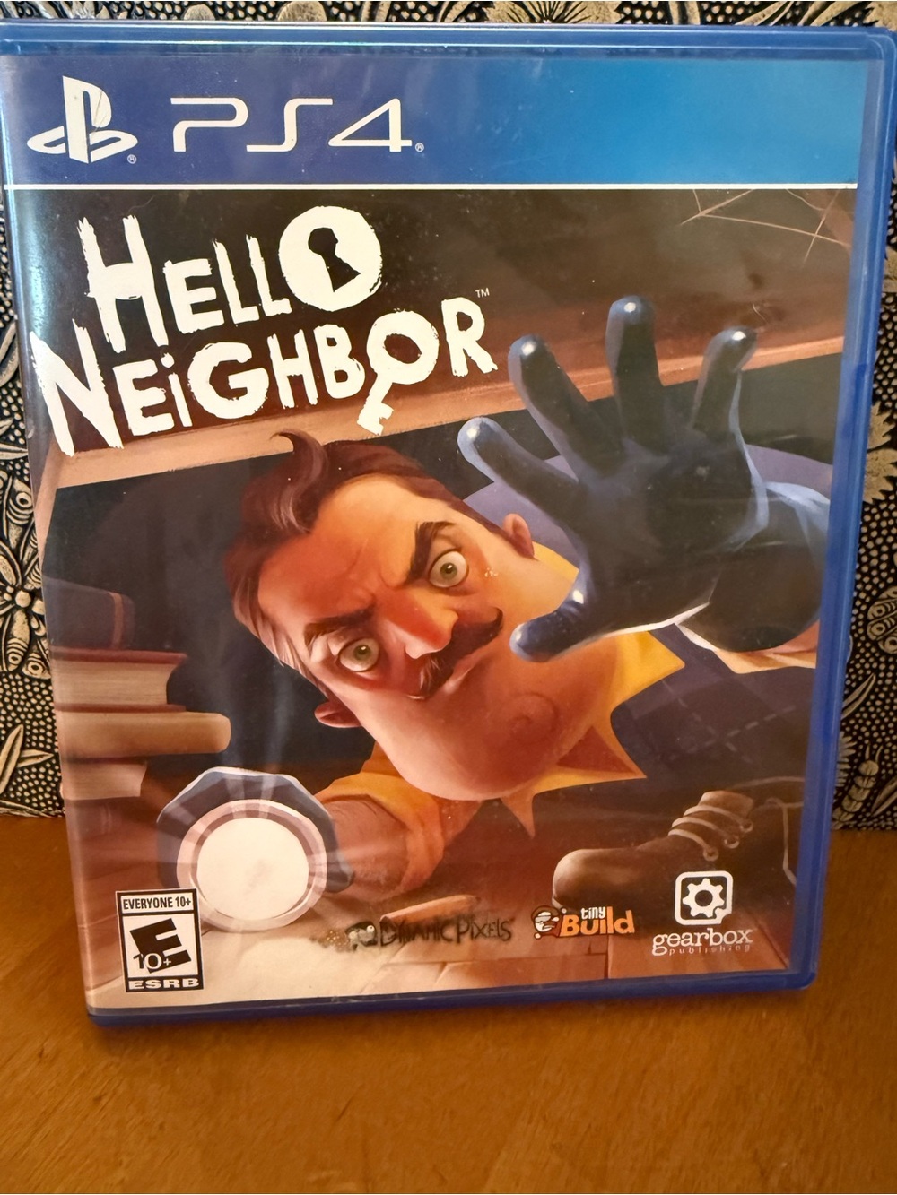 Hello Neighbor (PS4) Video Game — Blue Case with Colorful Cover